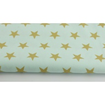Cotton 100% gold stars 25mm on mint background.