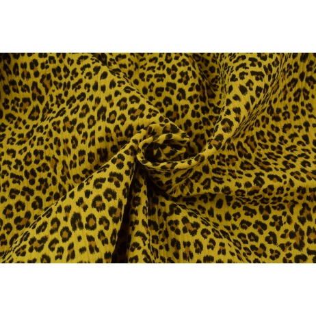 Double gauze 100% cotton panther pattern on a mustard background