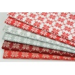 Cotton 100% silver-gold snowflakes on a red background