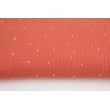 Double gauze 100% cotton golden marks on a coral background