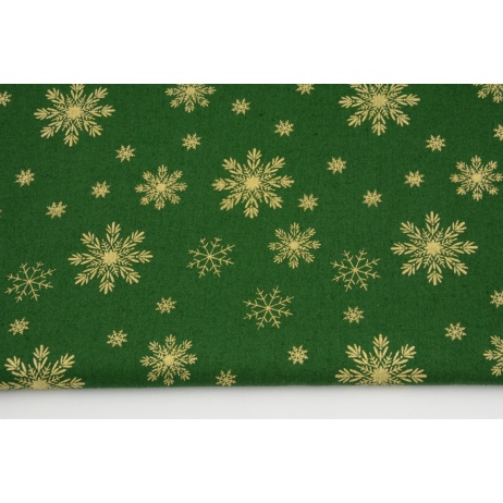 Cotton 100% golden snowflakes a green background, poplin