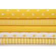 Cotton 100% polka dots 7mm on a yellow background