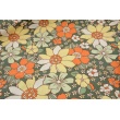 Cotton 100% large flowers orange-yellow on a green background