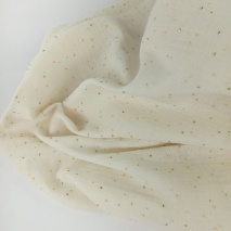 Double gauze 100% cotton golden mini dots on a cream background
