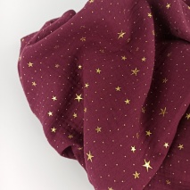 Double gauze 100% cotton gold stars on a burgundy background