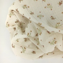Double gauze 100% cotton, brown, honey flowers on a vanilla background