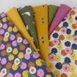 Cotton 100% colorful flowers on a vanilla background