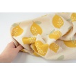 Double gauze, muslin 100% cotton large lemons on a beige background