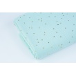 Double gauze 100% cotton golden dots on a mint background