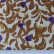 Double gauze 100% cotton, caramel and purple pattern on a vanilla background