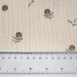 Organic cotton muslin with flowers on a natural background
