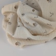 Organic cotton muslin with flowers on a natural background