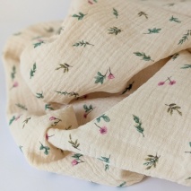 Double gauze 100% cotton, amaranth flowers on subtle beige