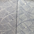 100% cotton, grey leaves on a cream background