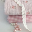 Double gauze 100% cotton brick flowers on a vanilla background