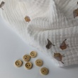 Cotton muslin, caramel birds on a cream background