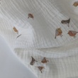 Cotton muslin, caramel birds on a cream background