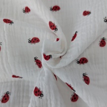 Double gauze 100% cotton, ladybugs on a cream background