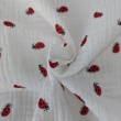 Double gauze 100% cotton, ladybugs on a cream background