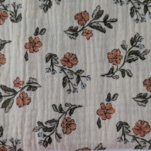 Cotton muslin with orange and blue flowers on a beige background