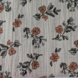 Cotton muslin with orange and blue flowers on a beige background