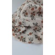 Cotton muslin with orange and blue flowers on a beige background