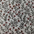 Double gauze 100% cotton, small orange flowers on a beige background
