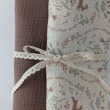 Double gauze 100% cotton, bunnies, birds, and flowers on a vanilla background