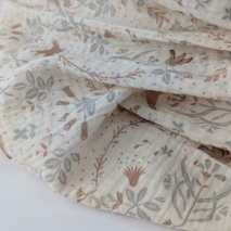 Double gauze 100% cotton, bunnies, birds, and flowers on a vanilla background