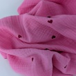 Double gauze 100% cotton, red hearts on a pink background