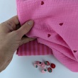 Double gauze 100% cotton, red hearts on a pink background