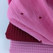 Double gauze 100% cotton, red hearts on a pink background