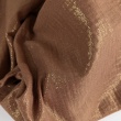 Double gauze 100% cotton shiny, golden particles on a caramel background