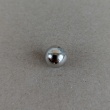 Silver metal button, 1 cm in diameter.