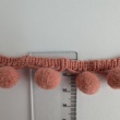 Salmon ribbon with pom poms - double thread.