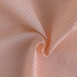 Cotton 100% white 2mm polka dots on a light orange background