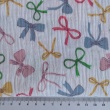 Cotton muslin, colorful bows on a white background