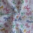 Cotton muslin, colorful bows on a white background