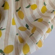 Cotton muslin, lemons on a vanilla background