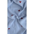 Cotton muslin with embroidered red hearts on a blue background
