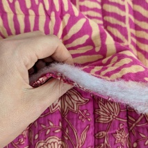 Quilted muslin, flowers on amaranth/ornament