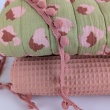 Quilted muslin, flowers/leopard print on an olive background