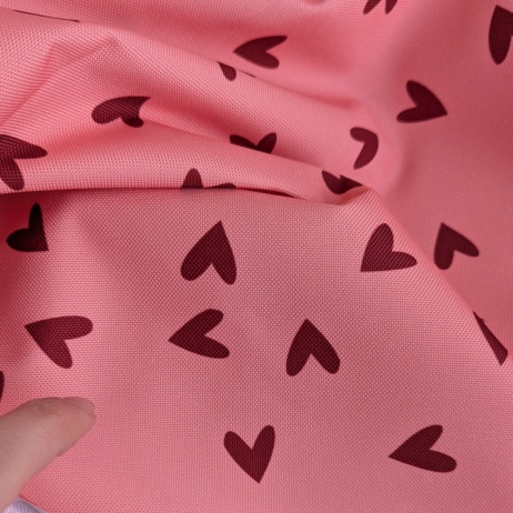 Waterproof fabric, Oxford, red hearts on a salmon background