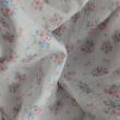 Organic cotton muslin, bows, bouquets on an ecru background