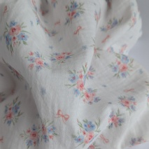Organic cotton muslin, bows, bouquets on an ecru background
