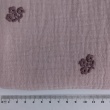 Cotton muslin, embroidered, heather flowers on a dusty heather background.