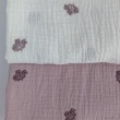 Cotton muslin, embroidered, heather flowers on a dusty heather background.