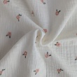 Cotton muslin, embroidered, salmon flowers on a cream background