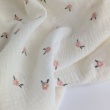 Cotton muslin, embroidered, salmon flowers on a cream background