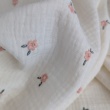 Cotton muslin, embroidered, salmon flowers on a cream background
